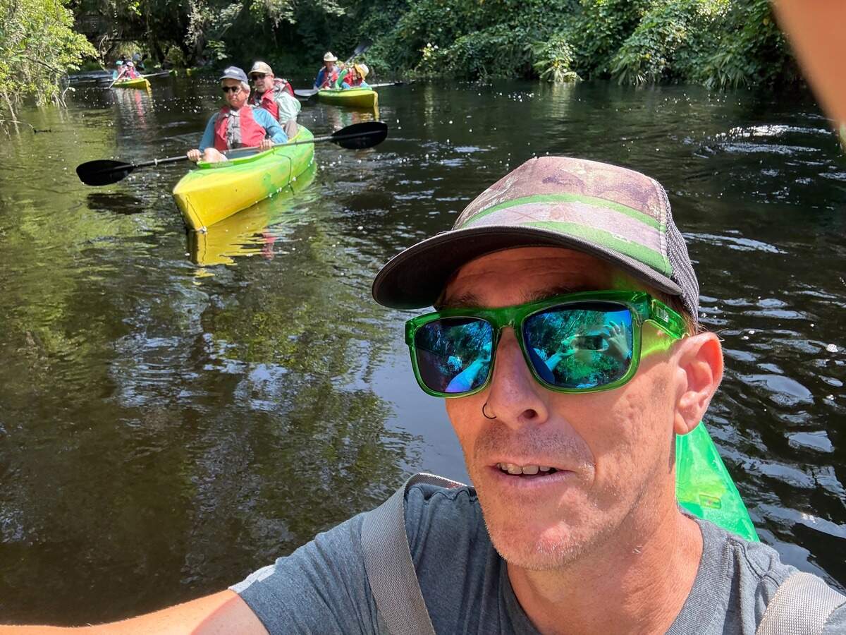 Seminole Tribe of Florida archaeologist and director of environmental protection Paul Backhouse paddles the headwaters of the Everglades in Central Florida with a group of conservationists.